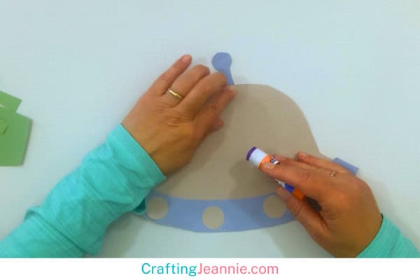 gluing the antenna on to the flying saucer craft