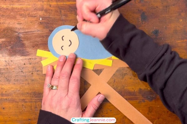 Baby Jesus craft - step 6 - Draw on a face
