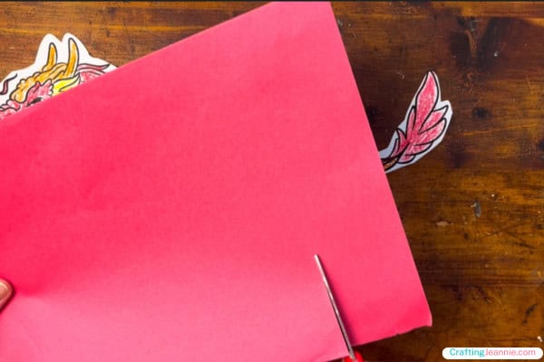 Cut out red strips of paper.