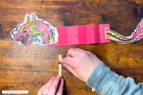color a popsicle stick with a crayon