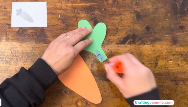 carrot craft step one, add glue to the carrot top